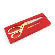 Side view of 9.5-inch stainless steel scissors designed for accurate tailoring.