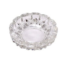 Glass ashtray for cigar and cigarette use.