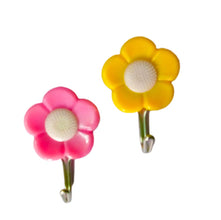 Pack of 5 adhesive flower-shaped hooks for wall decor.