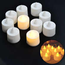 LED yellow tealight candles with white holders arranged together.