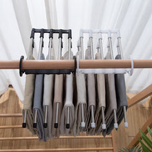 Space-saving trouser hanger with adjustable arms for versatile storage