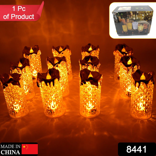 Set of gold flameless LED candles with a warm glow, ideal for home decor and special occasions.